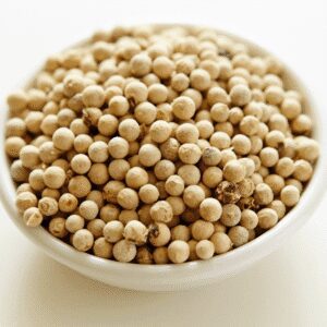 A bowl filled with white peppercorns.